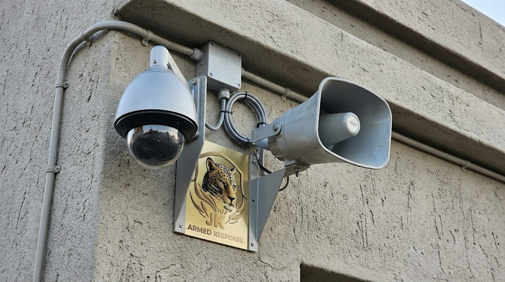 Active deterrence security camera with two-way audio speaker for off-site monitoring voice-down warnings.