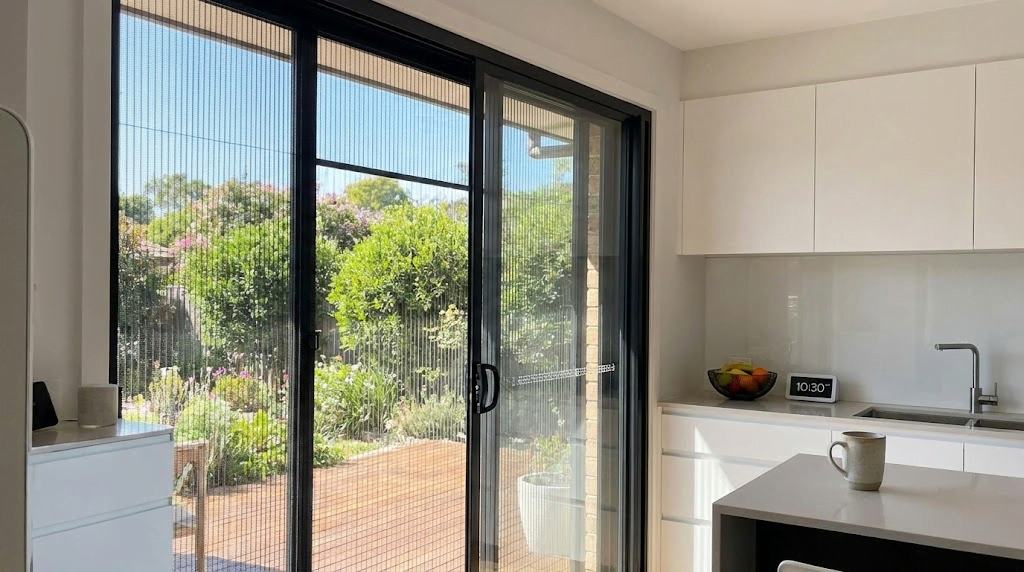 High-tensile stainless steel monkey proof security screen installed on a modern kitchen sliding window